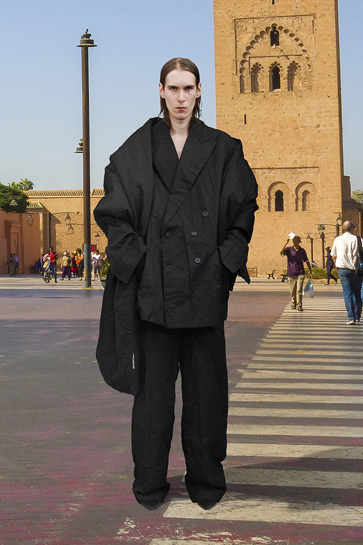 Lexica  Arab male model walking dow the catwalk fashion streetwear  oversized balenciaga